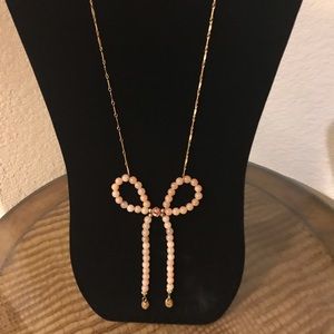 Lenora dame Anthropologie pink bow necklace